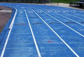 Today's modern outdoor track is oval in shape with a distance set at 400 meters with eight lanes. The earliest tracks had a surface of dirt and cinders. Today's tracks are composed of synthetic, rubber composite surfaces that are durable and built for better traction for athletes.