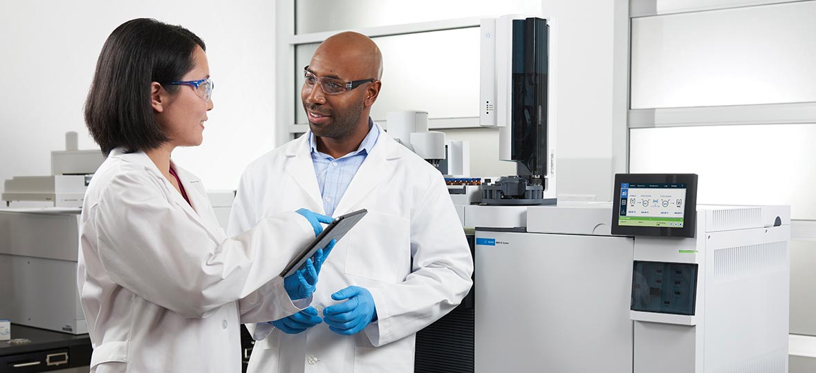 Two lab technicians working in a lab