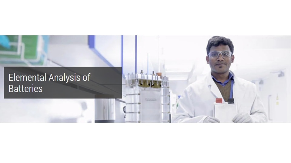A scientist in a lab coat and safety glasses holds battery, standing in a bright lab. Text reads "Elemental Analysis of Batteries." Professional and focused tone.